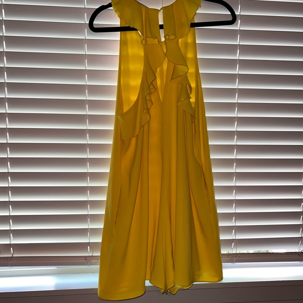 Zara romper . Ruffle sleeve open back